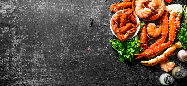 Cooked,Shrimp,,Crayfish,And,Crab,With,Parsley.,On,Dark,Rustic