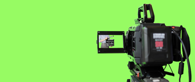 Broadcast,Camera,In,Studio,With,Green,Screen,At,Tv,Station.