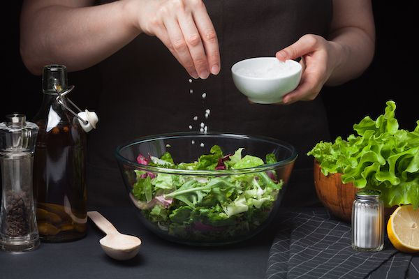 Woman,Chef,In,The,Kitchen,Preparing,Vegetable,Salad.,Healthy,Eating.