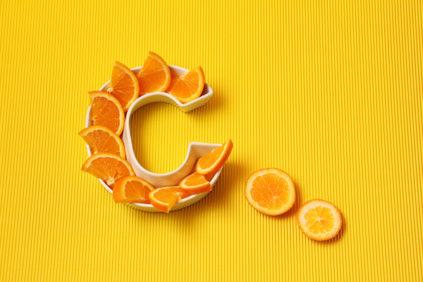 Vitamin,C,In,Food,Concept.,Plate,In,Shape,Of,Letter