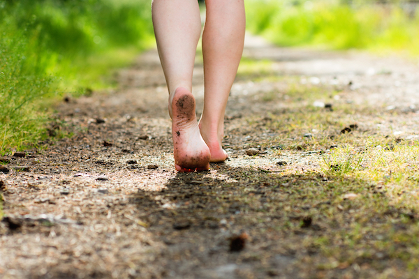 Woman,Legs,Walking,In,Summer,Forest.,Barefoot,And,Health,Concept.