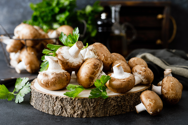Raw,Mushrooms,Champignons,On,Black,Background,,Cooking,Fresh,Champignons