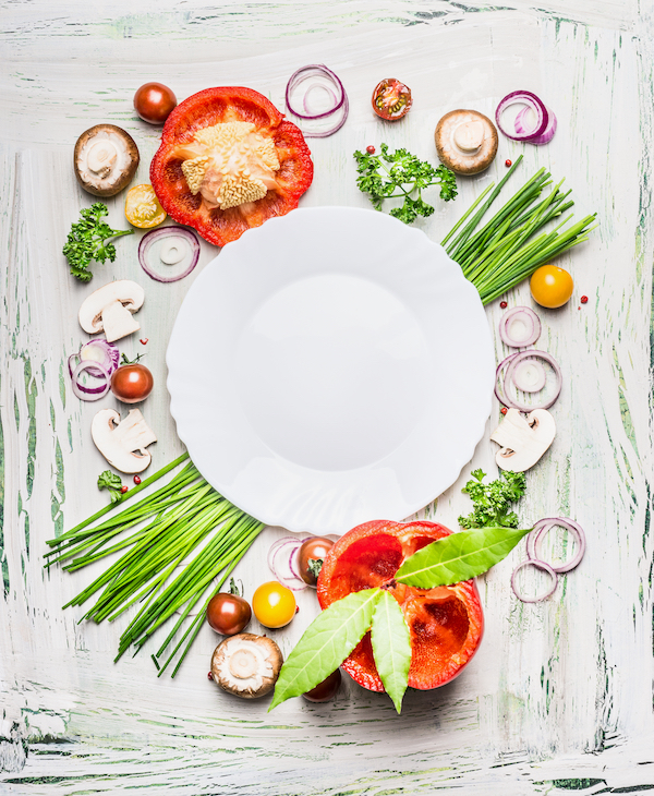 Various,Vegetables,And,Seasoning,Cooking,Ingredients,Around,Blank,Plate,On