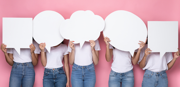 Diverse,Women,Holding,Blank,Speech,Bubbles,In,Front,Of,Faces