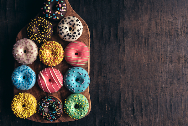 Glazed,Mini,Donuts,On,Wooden,Background,With,Blank,Space