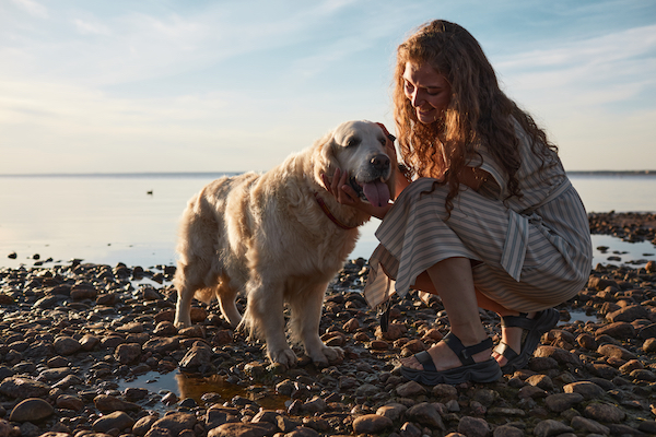 Woman with Dog by Lake