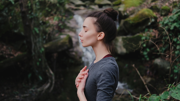 Young,Woman,Practicing,Breathing,Yoga,Pranayama,Outdoors,In,Moss,Forest