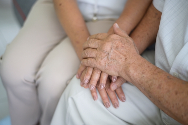 Close up of elderly hands holding each other , Grandfather hands is holding grandma hands , together , family concept