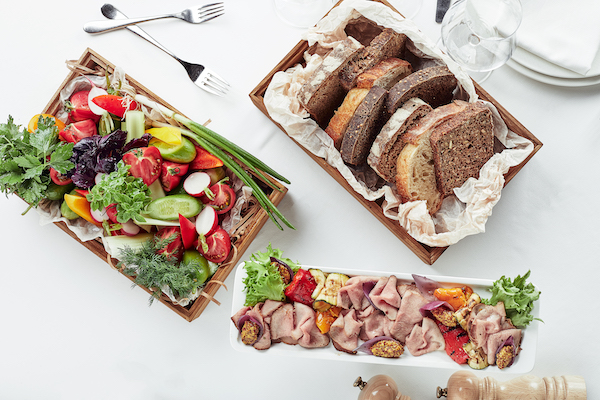 Beautifully decorated catering banquet table with different food snacks and appetizers