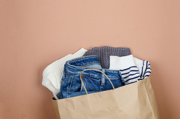 craft paper bag with full of used clothing  for recycling or donation