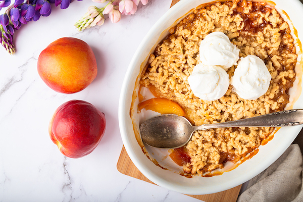 Homemade nectarine crumble with vanilla ice cream