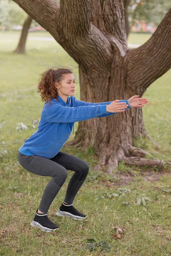 athletic-european-woman-in-blue-skinny-doing-sport-2023-11-27-05-14-41-utc