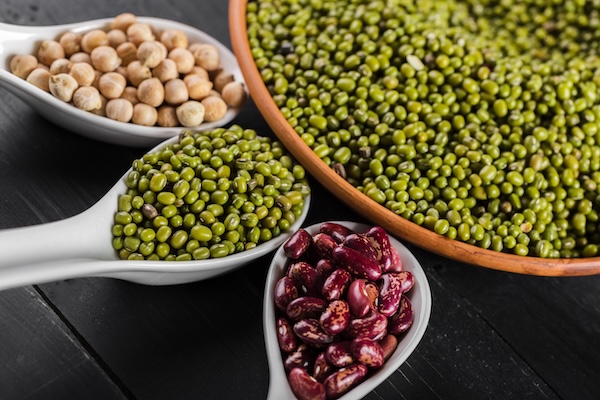 mix of beans on wooden table