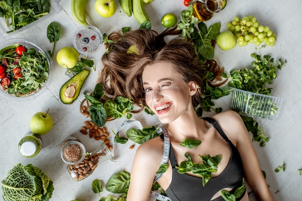 Portrait of a beautiful woman with healthy food